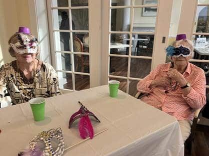 2 Senior Women in Mardi Gras mask